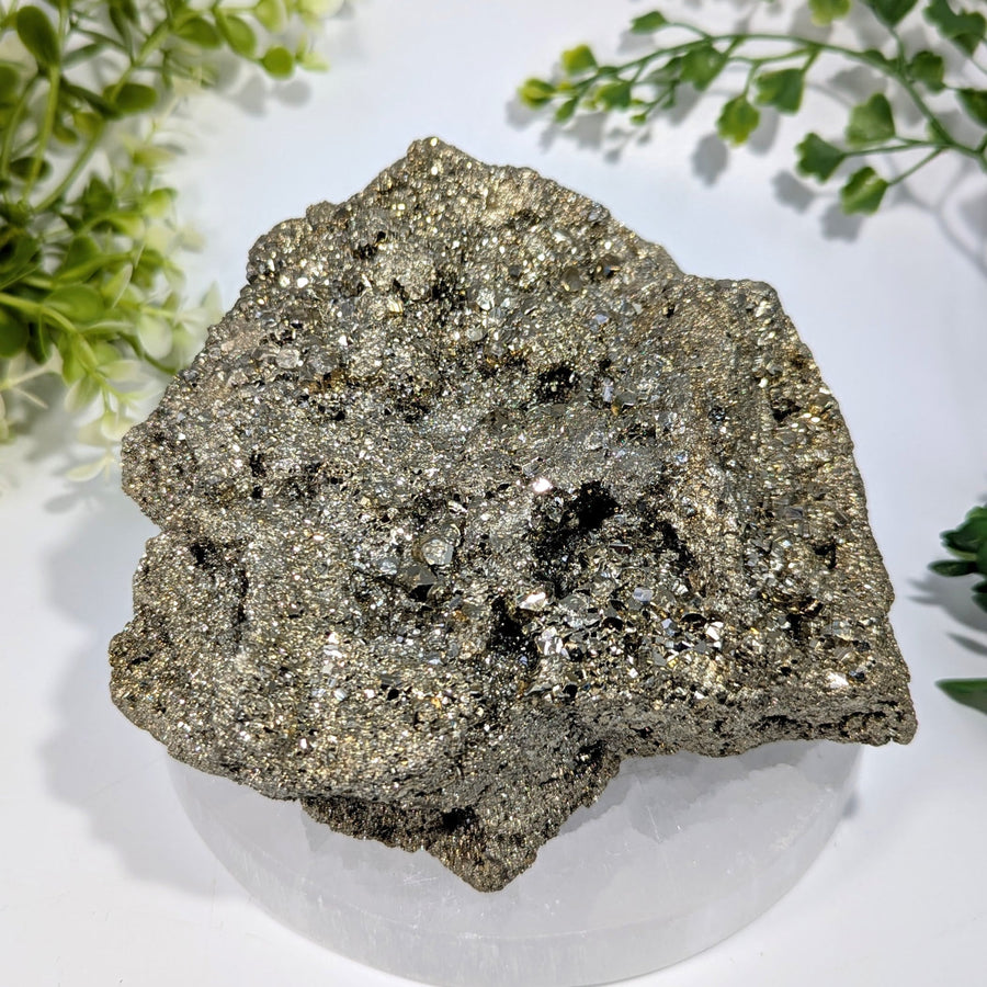 A 5.3 inch natural pyrite cluster with an irregular shape and a metallic gold and silver sheen