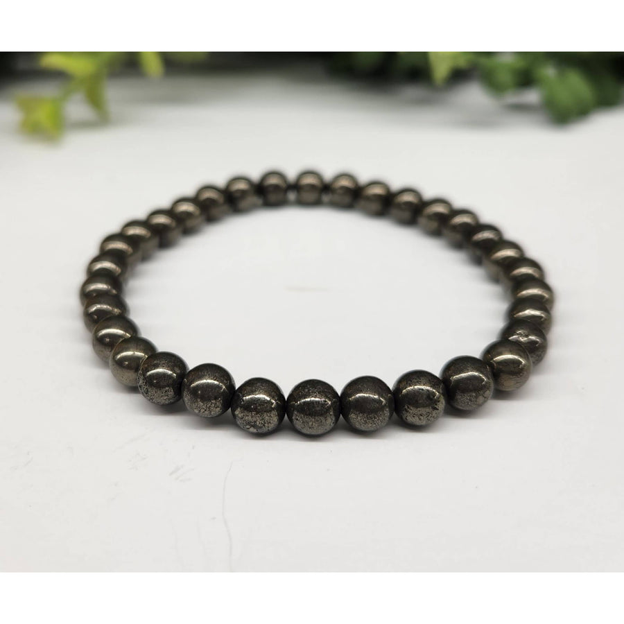 Pyrite 6mm 7.5’ Beaded Bracelet #LV5334 featuring the elegant black lava bracelet