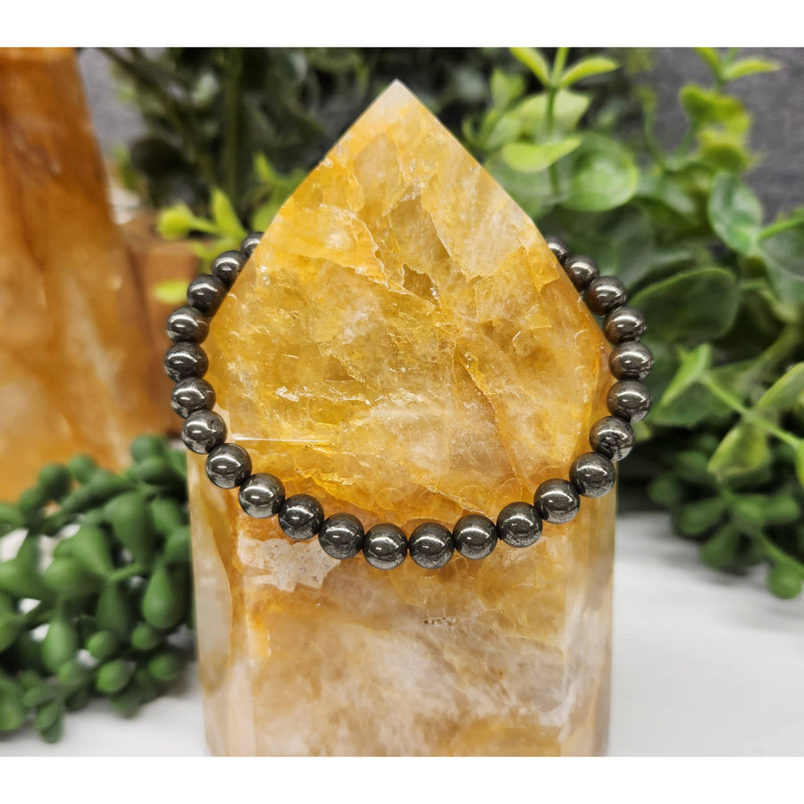 Golden quartz ring displayed with Pyrite 6mm 7.5’ Beaded Bracelet #LV5334 in a product image