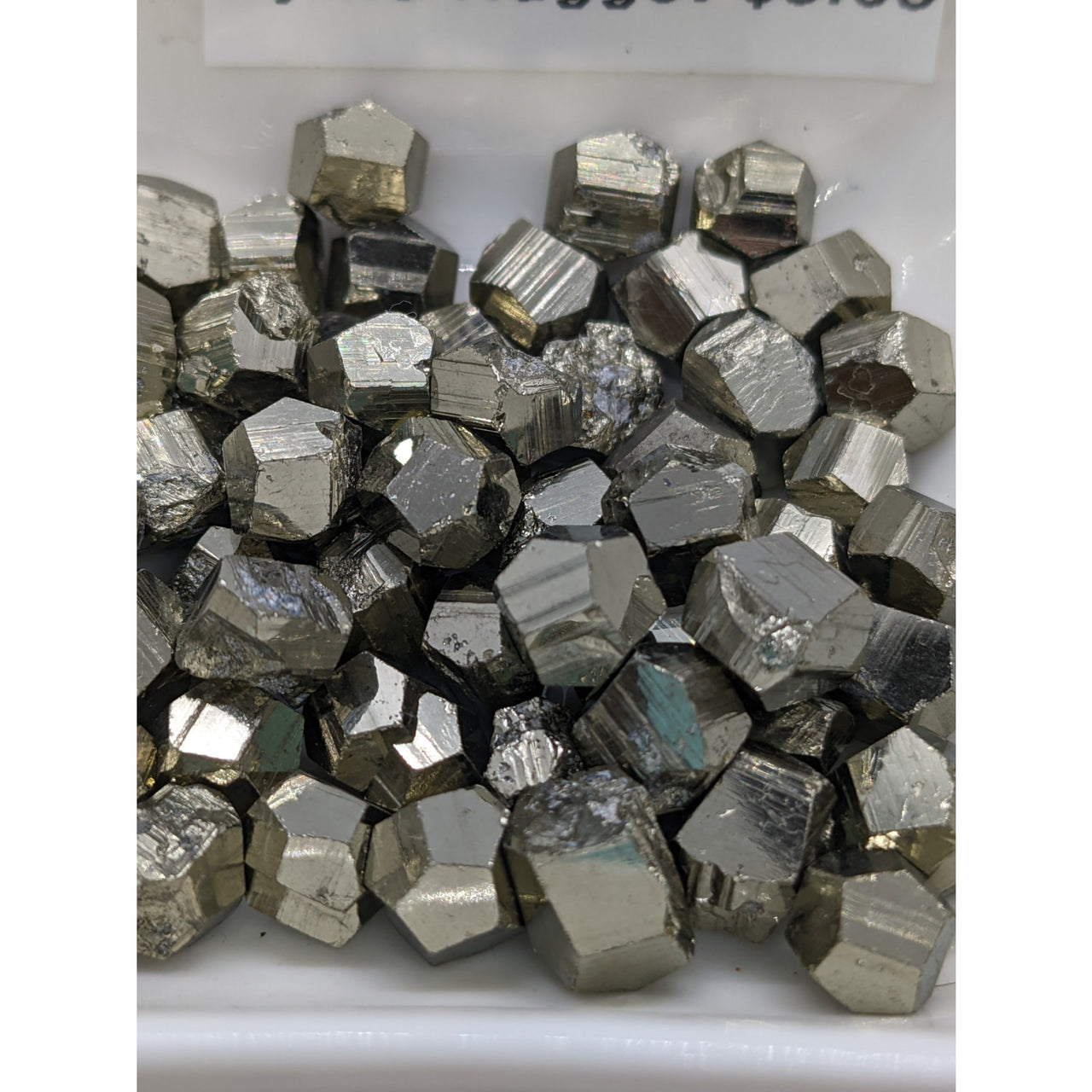 Metallic Pyrite Mini Nugget showcasing unique cubic and dodecahedral crystal shapes