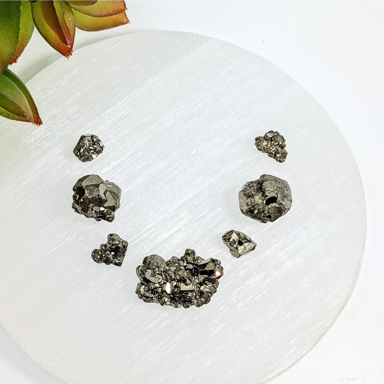 Metallic pyrite crystals in a smiling face pattern for Pyrite Nugget Rough Bead