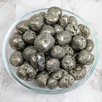 Thumbnail for Silver foiled chocolates in a bowl displayed with Pyrite Round Tumble Stone #LV2260