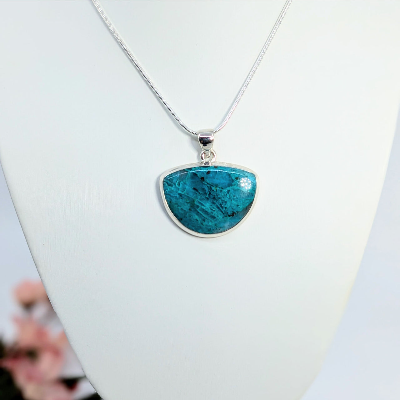 Semi-circular turquoise Quantum Quattro pendant on a silver chain necklace