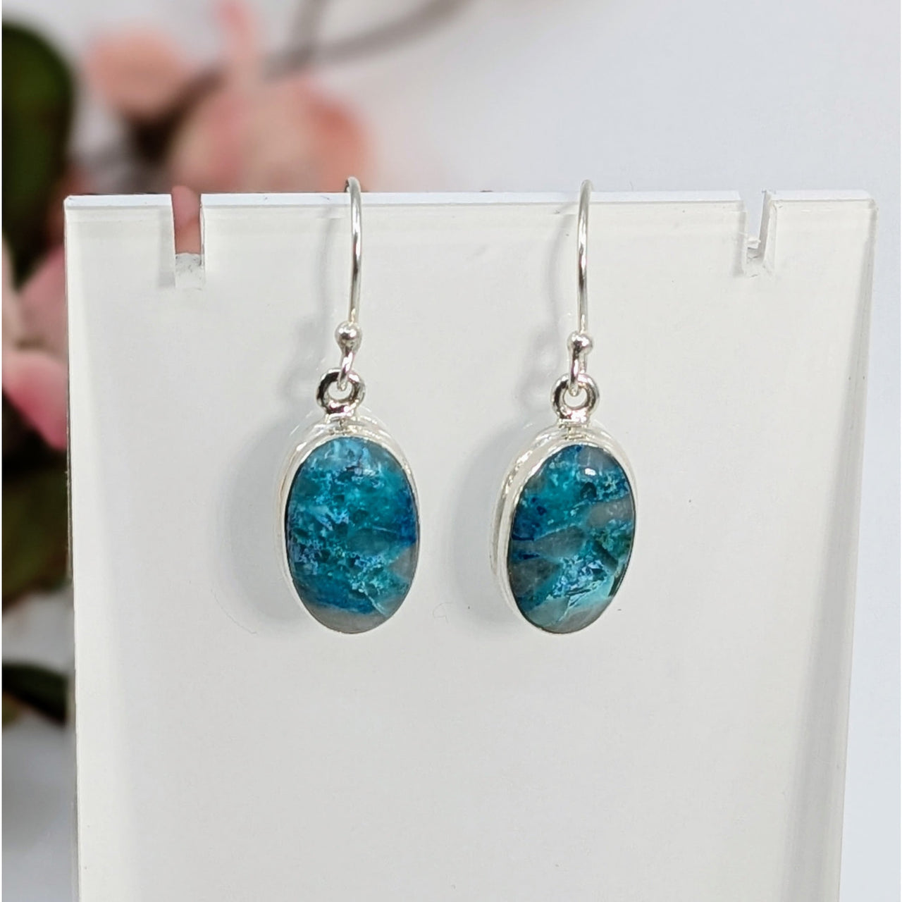 Elegant Quantum Quattro oval earrings with turquoise-blue gemstones and silver hooks