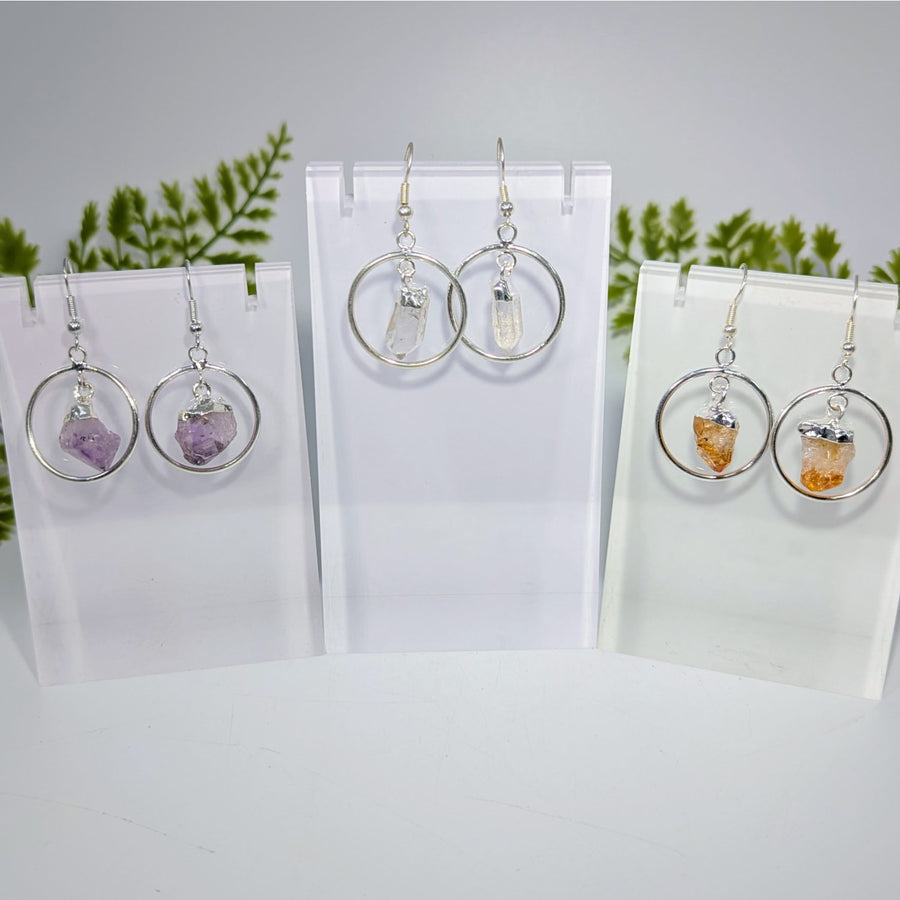 Silver hoop earrings with raw faceted purple clear and orange quartz point crystals in 1 inch metal ring jewelry