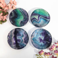 Round rainbow fluorite marble coasters with green purple swirls