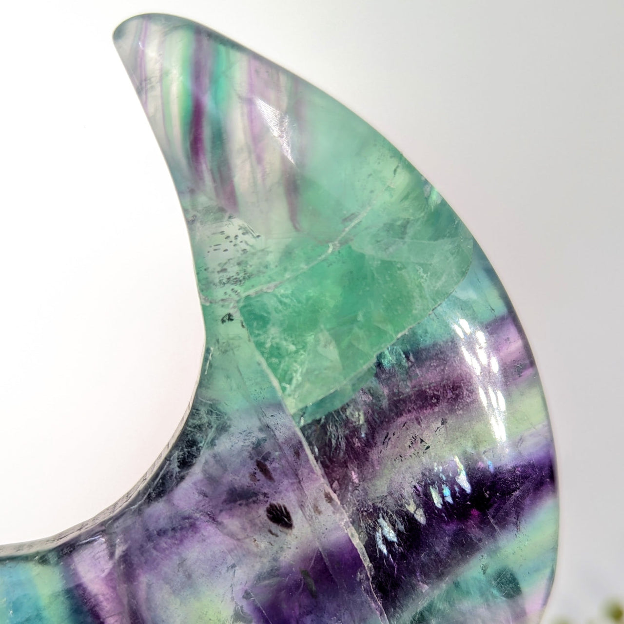 Translucent crescent fluorite geode moon with green-purple bands, 4 inch damaged tip
