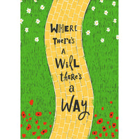 Yellow brick road winds through green grass with white and red flowers in Raise Your Vibration Oracle Deck LV9600