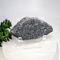 Raw 3.3-inch hematite shimmer stone #BC0608 on acrylic stand