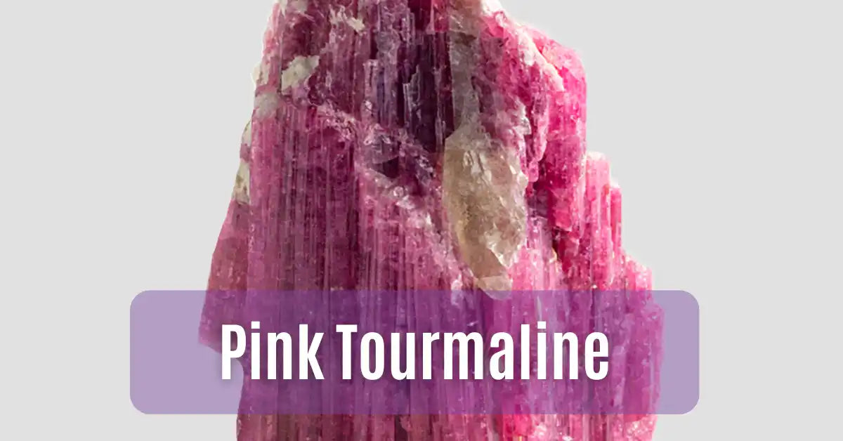 Raw pink tourmaline crystal with striated faces and color zoning.