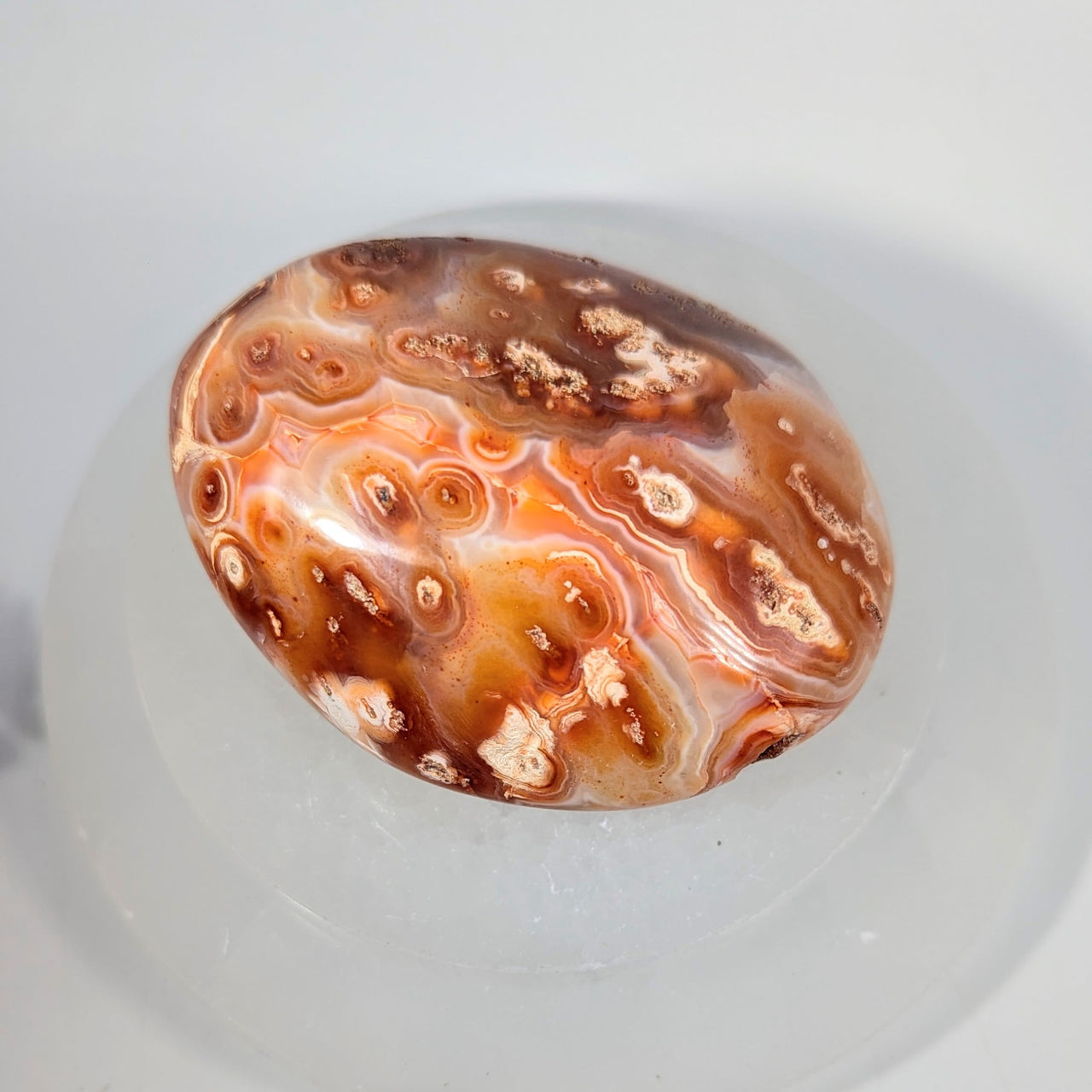 Polished oval red agate pebble 3.25in #BC0250 with swirls