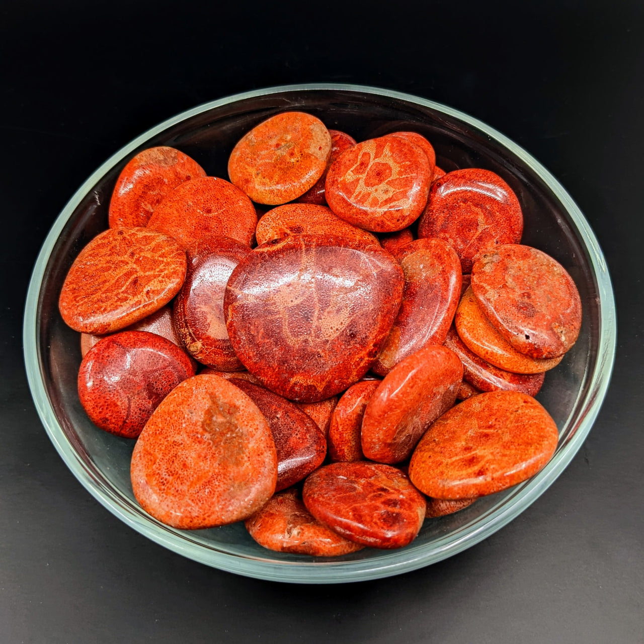 Bowl of sliced tomatoes and sausages beside Red Coral Sponge Palm Stone #LV2719