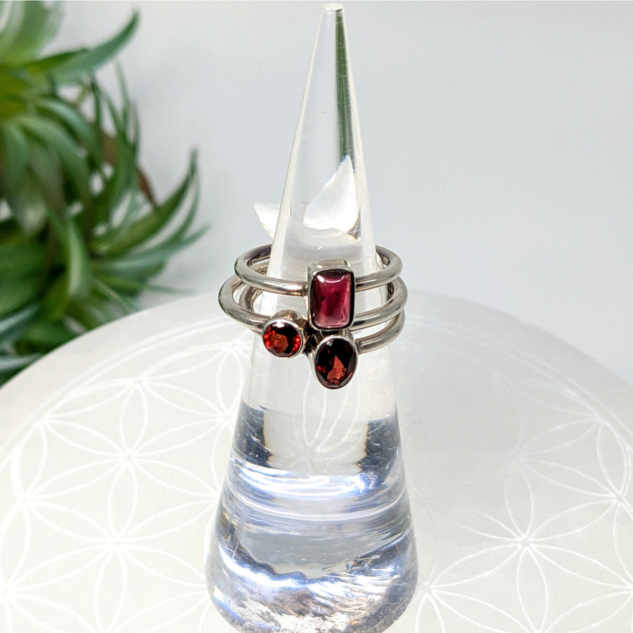 Sterling silver ring with three red garnet gemstones, dainty and stylish jewelry