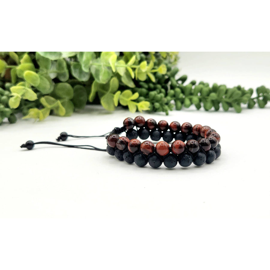 Two beaded bracelets featuring Red Tiger Eye and Black Lava woven adjustable beads