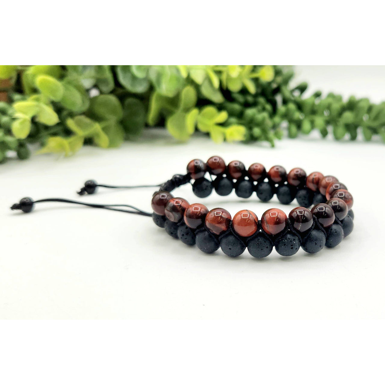 Two-strand beaded bracelet featuring Red Tiger Eye and Black Lava woven design