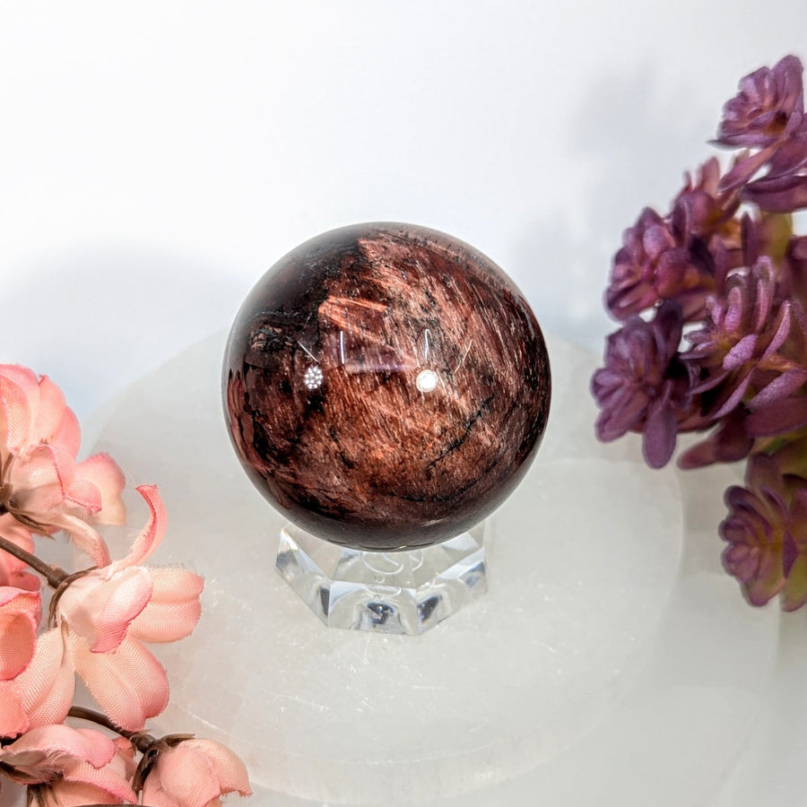 Polished red tiger’s eye 1.8-inch sphere #BC0701 on crystal stand