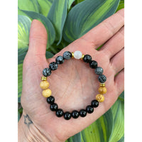 Black and gold Release Beaded Bracelet with snowflake obsidian, selenite, obsidian, and Palo Santo #LV9556