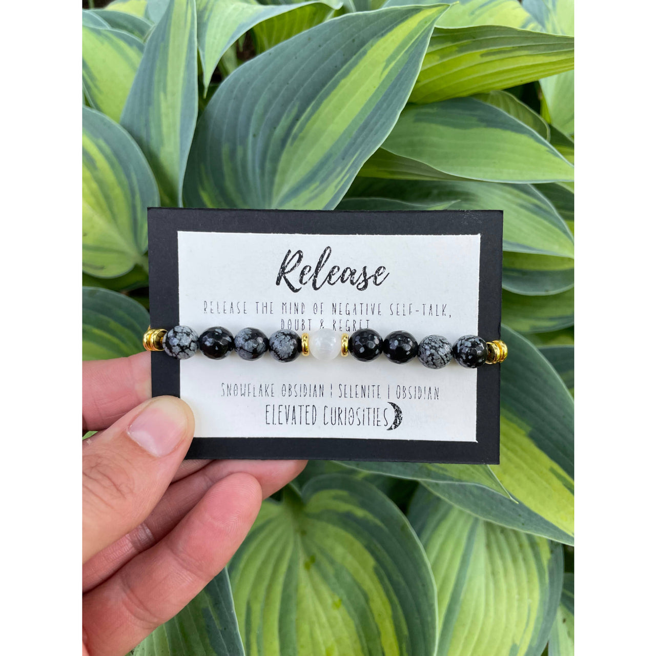 Black and gray beaded Release Bracelet with gold accents by Elected Curiosities