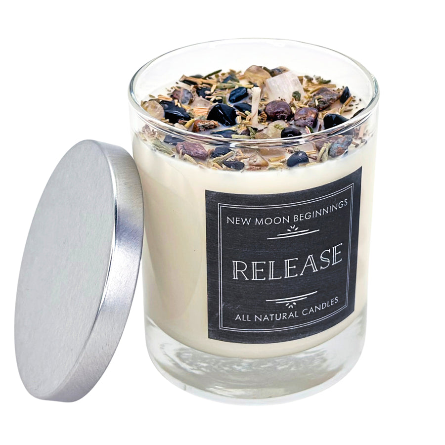 Release Ritual Candle: Cream soy jar with silver lid, herbs, and stones