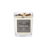 Release ritual soy herb crystal candle with colorful stones and label