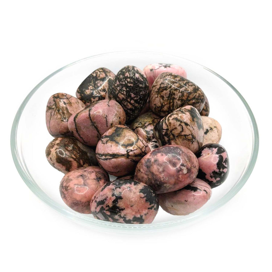 Pink and black marbled Rhodonite Tumbled Stone XL in a clear glass bowl