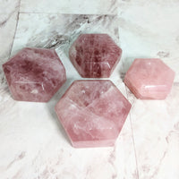 Thumbnail for Three rose quartz hexagon-shaped sphere holders on marble table. #LV2319