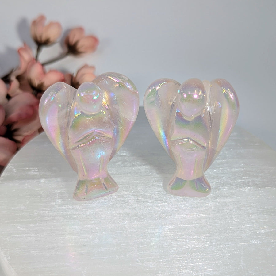 Two iridescent rose quartz 2-inch angel aura figurines with delicate wings