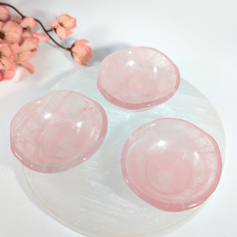 Three translucent pink rose quartz 2-inch mini bowls with natural inclusions
