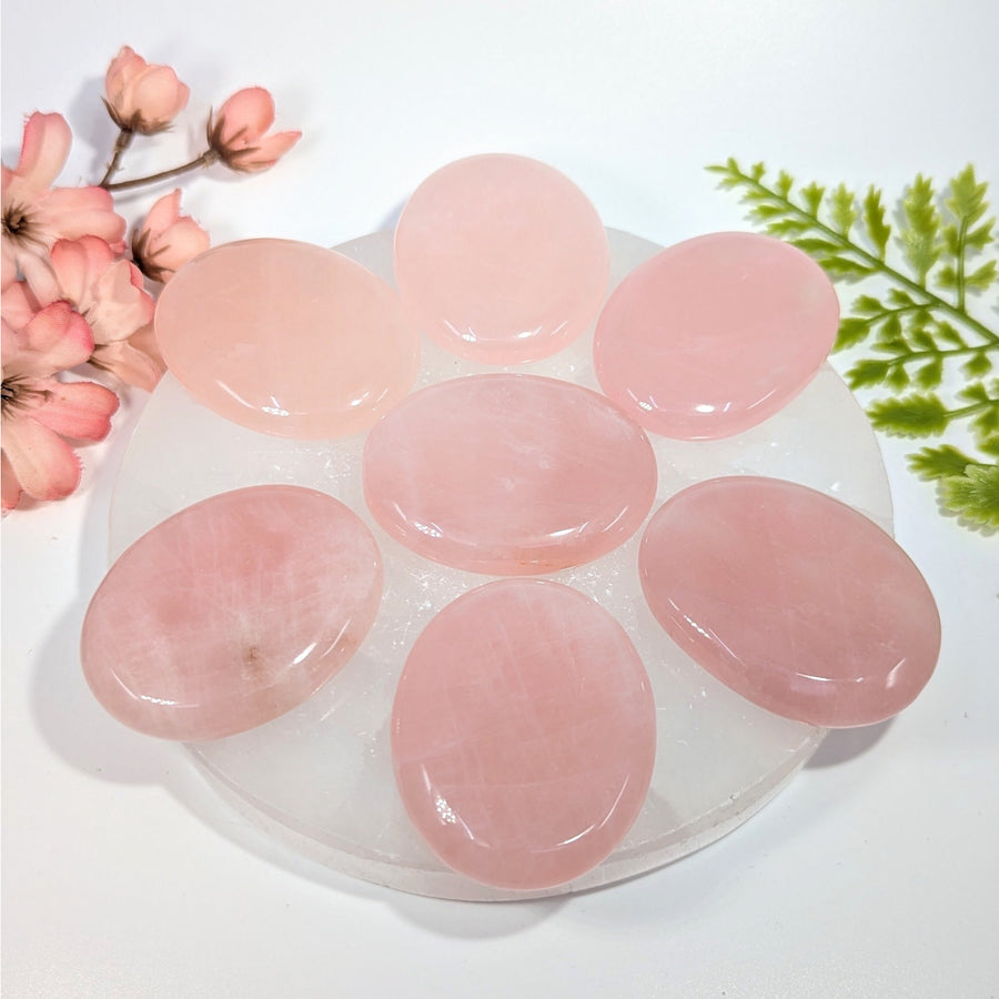 Six smooth oval pink rose quartz 2in thumb stones #BC0764 on white plate