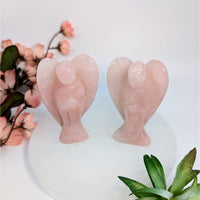 Two pink rose quartz large angel carvings symbolizing heart’s deepest yearnings naturally