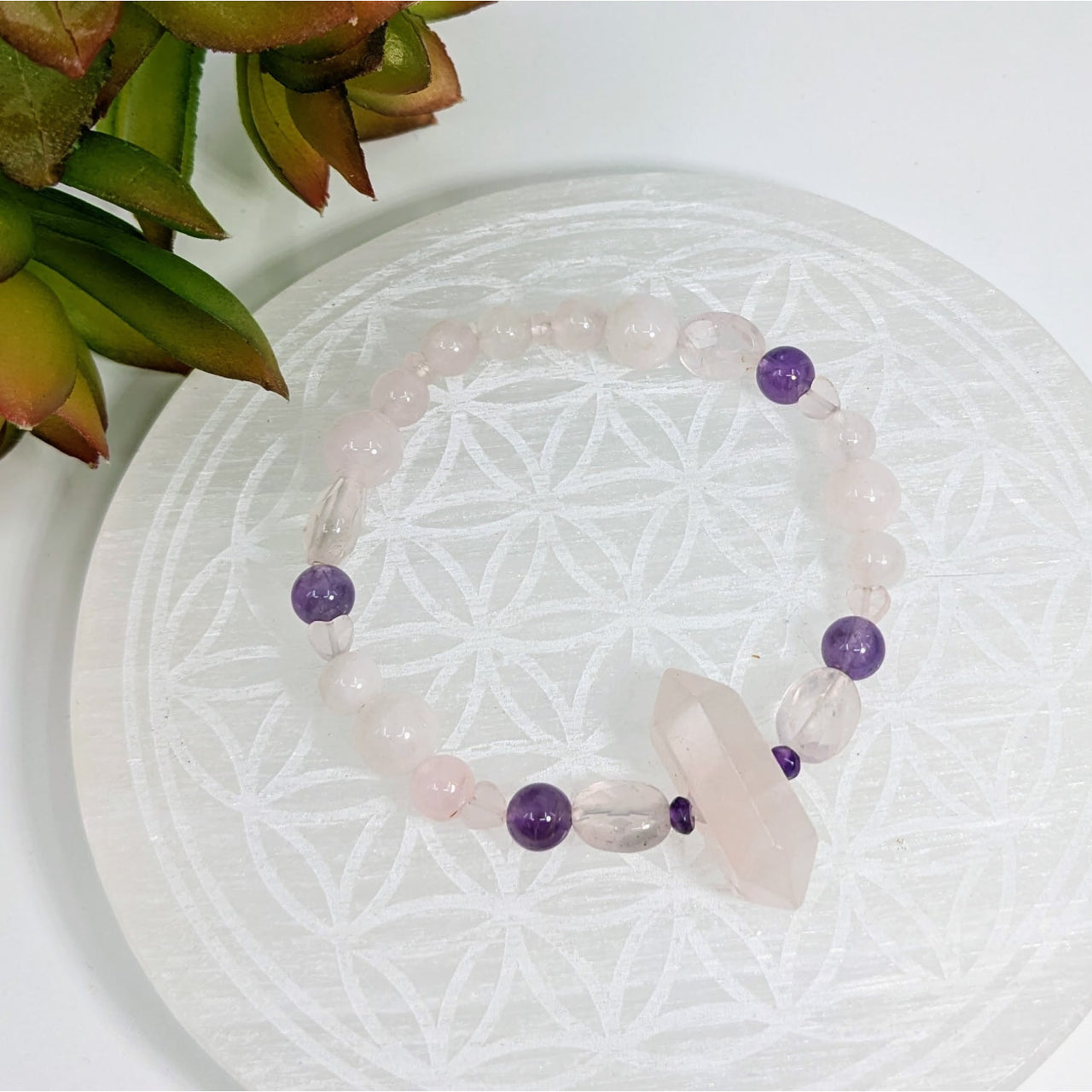 Crystal bracelet featuring rose quartz and amethyst beads for blissful energy