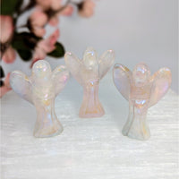 Three iridescent angel figurines displayed in the Rose Quartz Aura 1.5 inch Mini Angel Carving