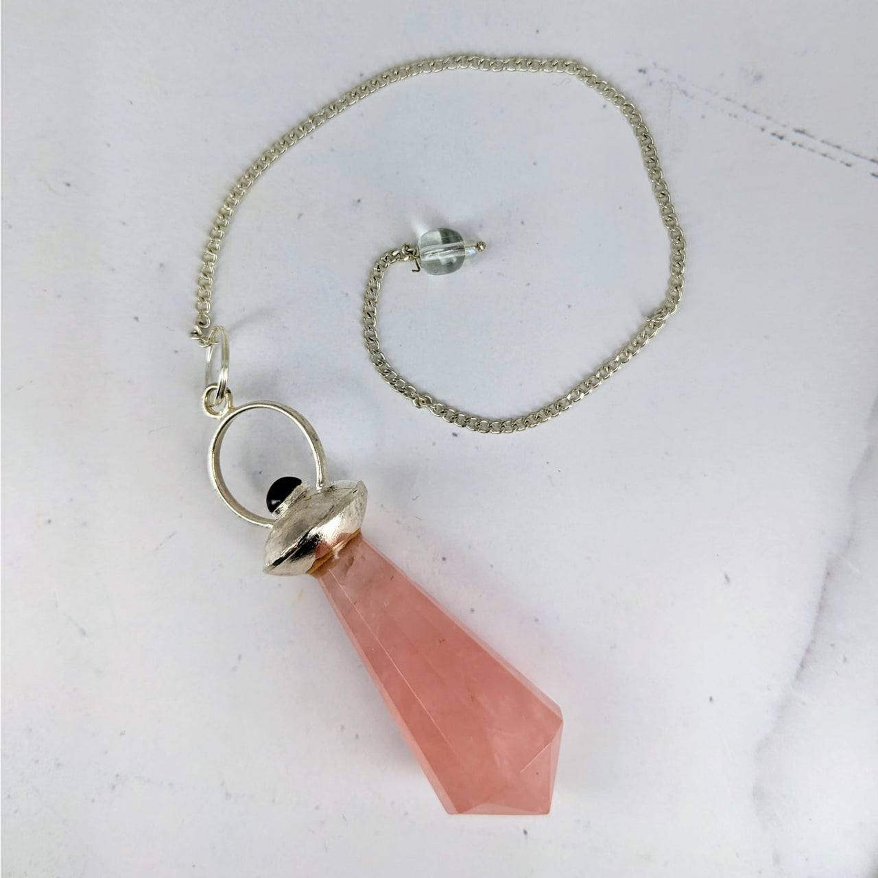 Elegant necklace featuring a pink rose quartz stone on a silver chain - Rose Quartz + Garnet