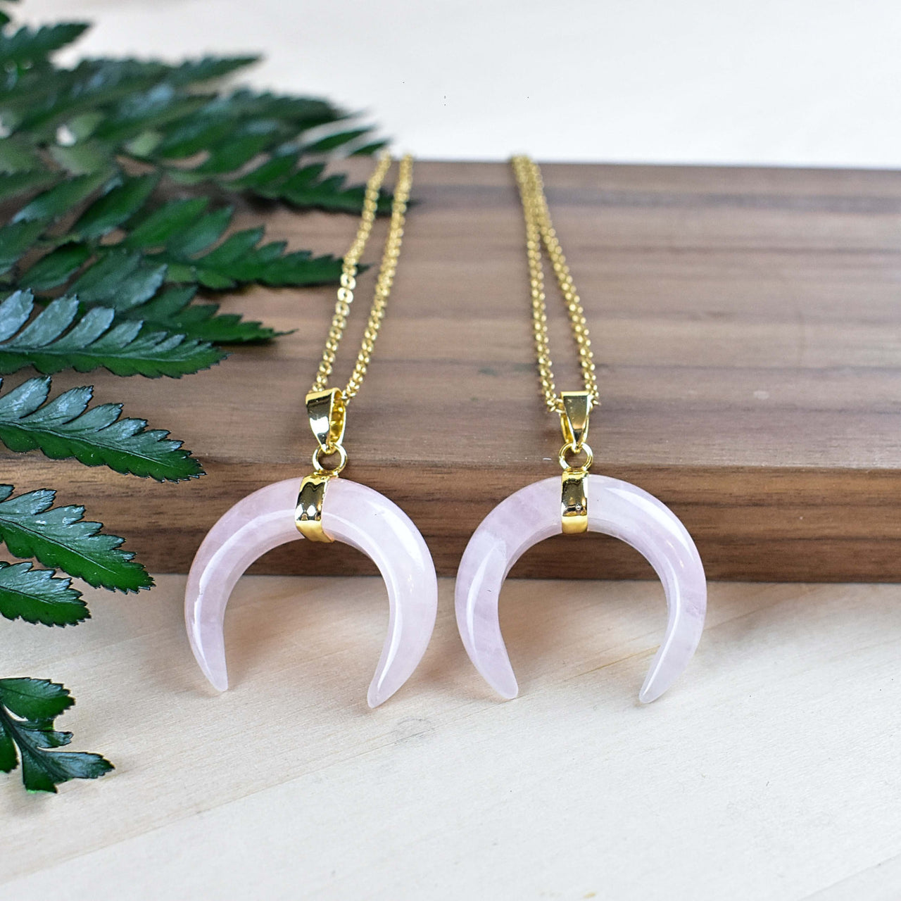 Two rose quartz crescent moon pendants on 18-inch gold chains, LV9191