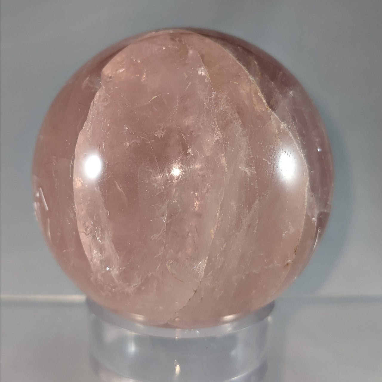 Rose Quartz Sphere 3.5’’ on a clear stand, perfect for decoration and healing energy