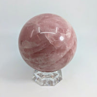 Thumbnail for Rose Quartz Sphere 3.5’’ on clear crystal stand showcasing beautiful Rose Quartz Sphere