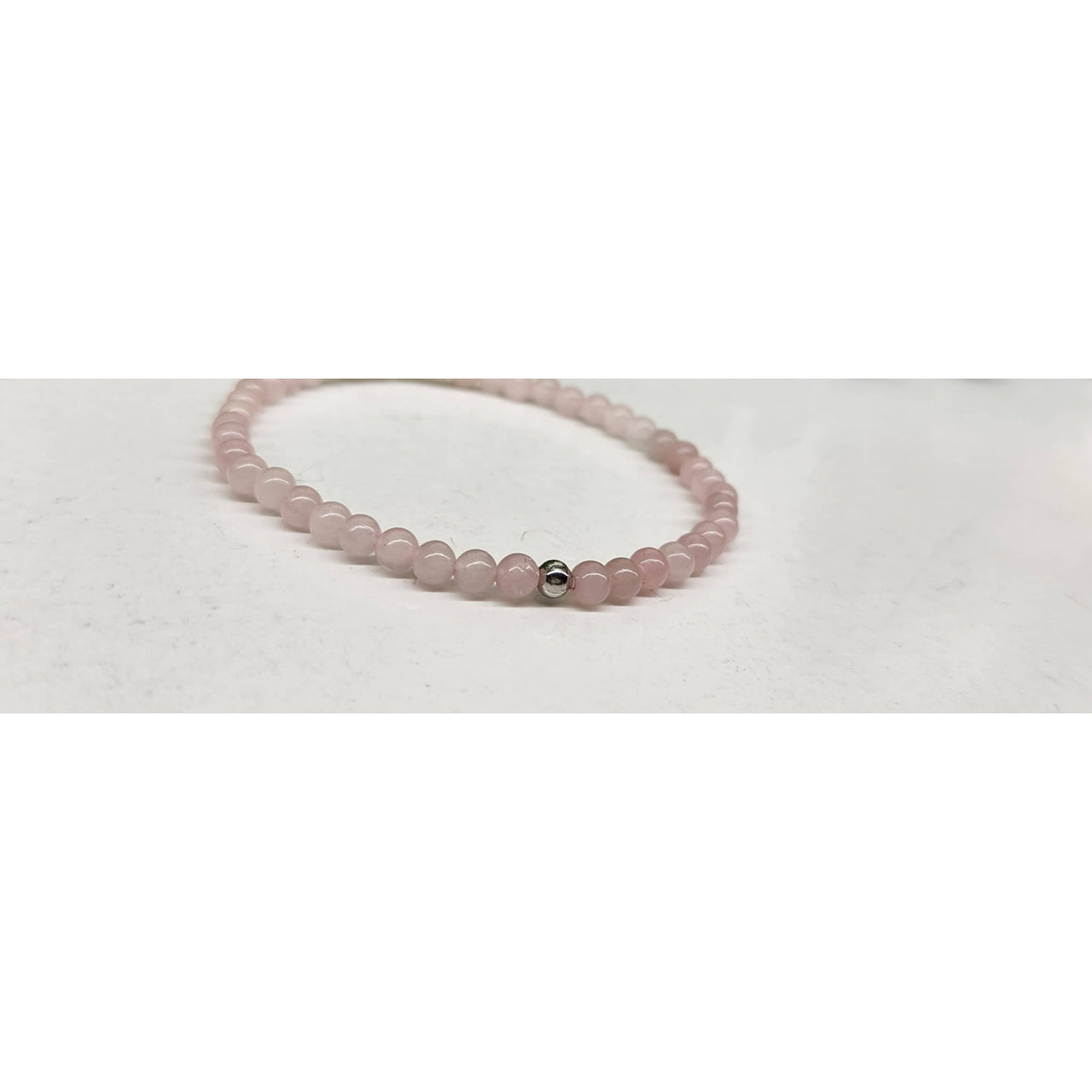 Pink beaded bracelet with silver accents from Rose Quartz Stretchable Bracelet 4MM Beads