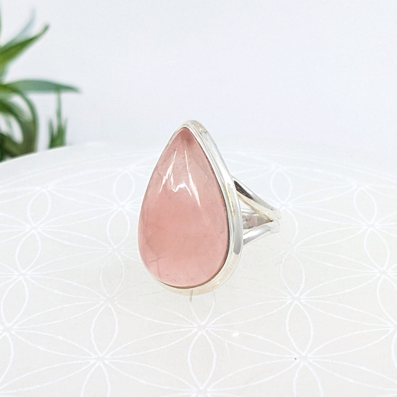 Teardrop ring featuring a rose quartz gemstone set in sterling silver