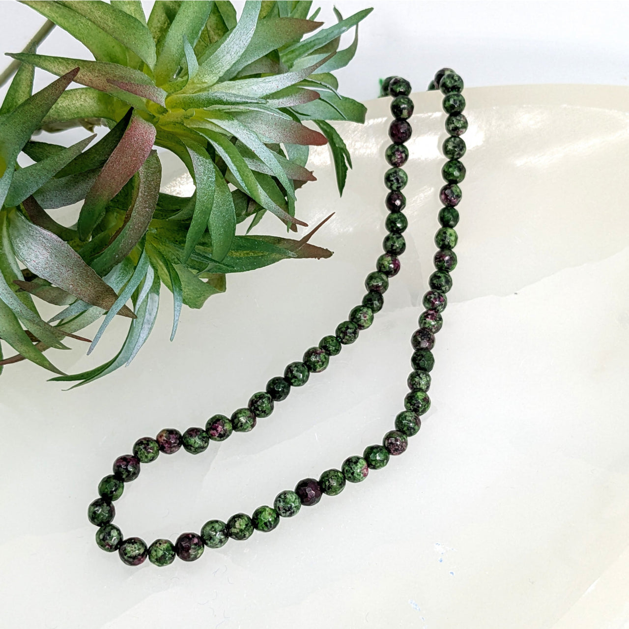 Dark green Ruby Zoisite Faceted 6mm Round Bead Strand with marbled gloss