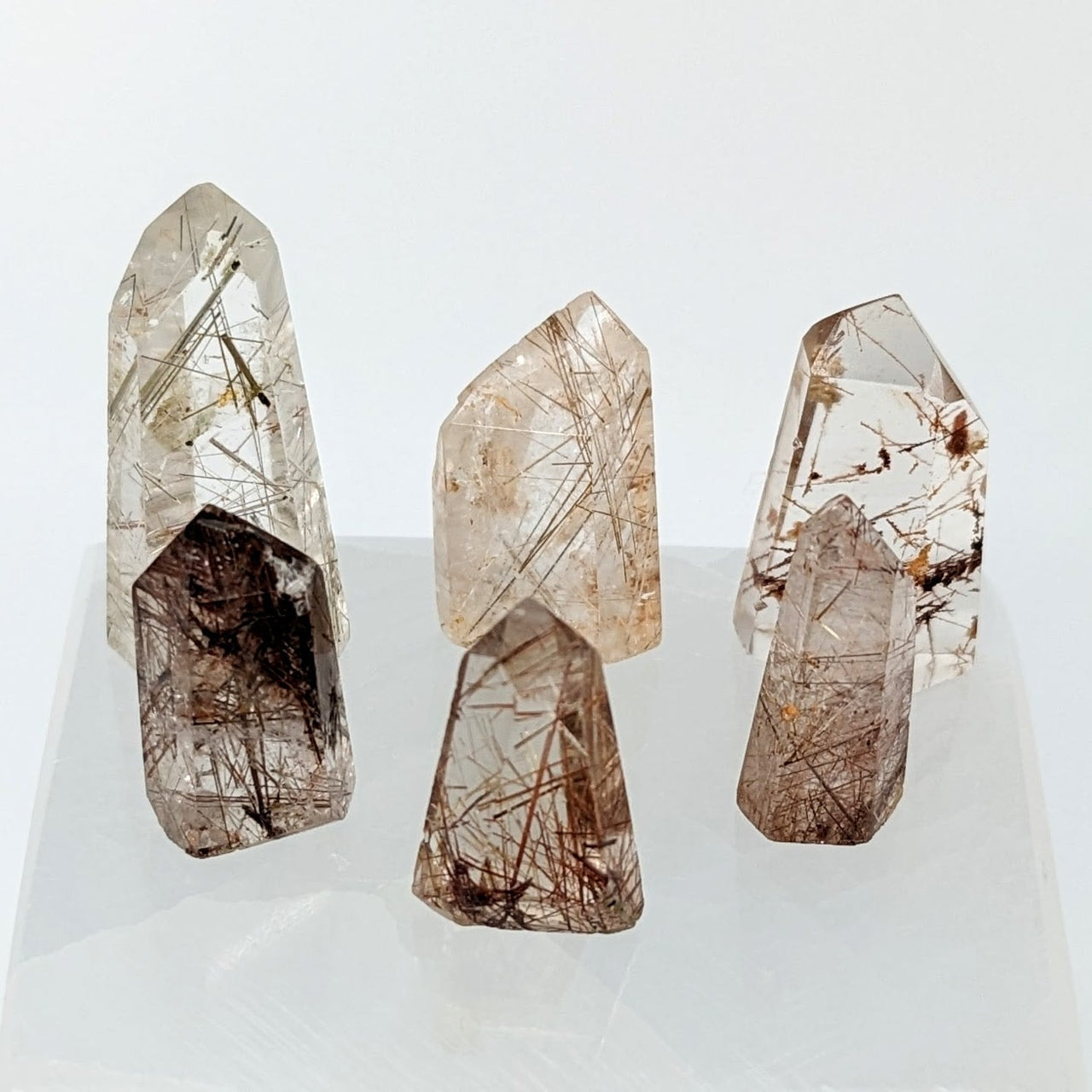 Three Rutilated Quartz Mini Towers on a white surface - Product #LV2446