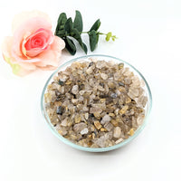 Thumbnail for Bowl of rutilated quartz crystals and a rose from Rutilated Quartz Gravel Mini Chips #LV3074