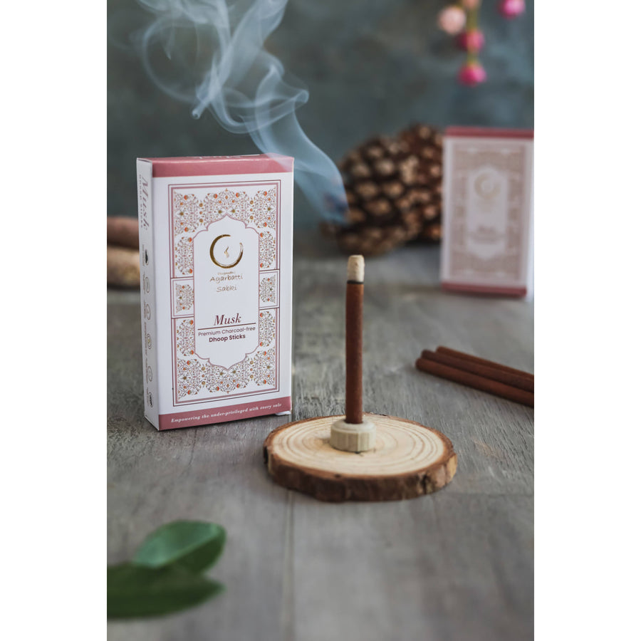 Burning incense stick from Saffron-Sandalwood Musk Tuberose Combo Pack Dhoop Sticks