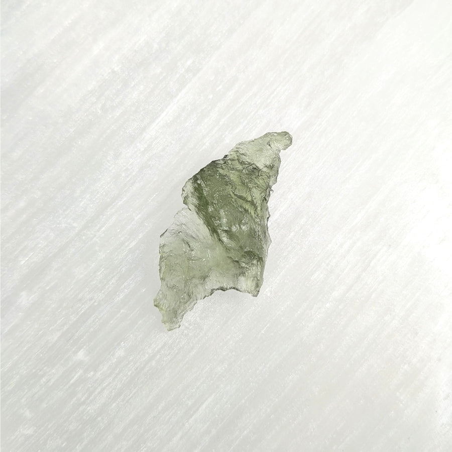 Irregular pale green Moldavite Raw Besednice crystal from the Czech Republic