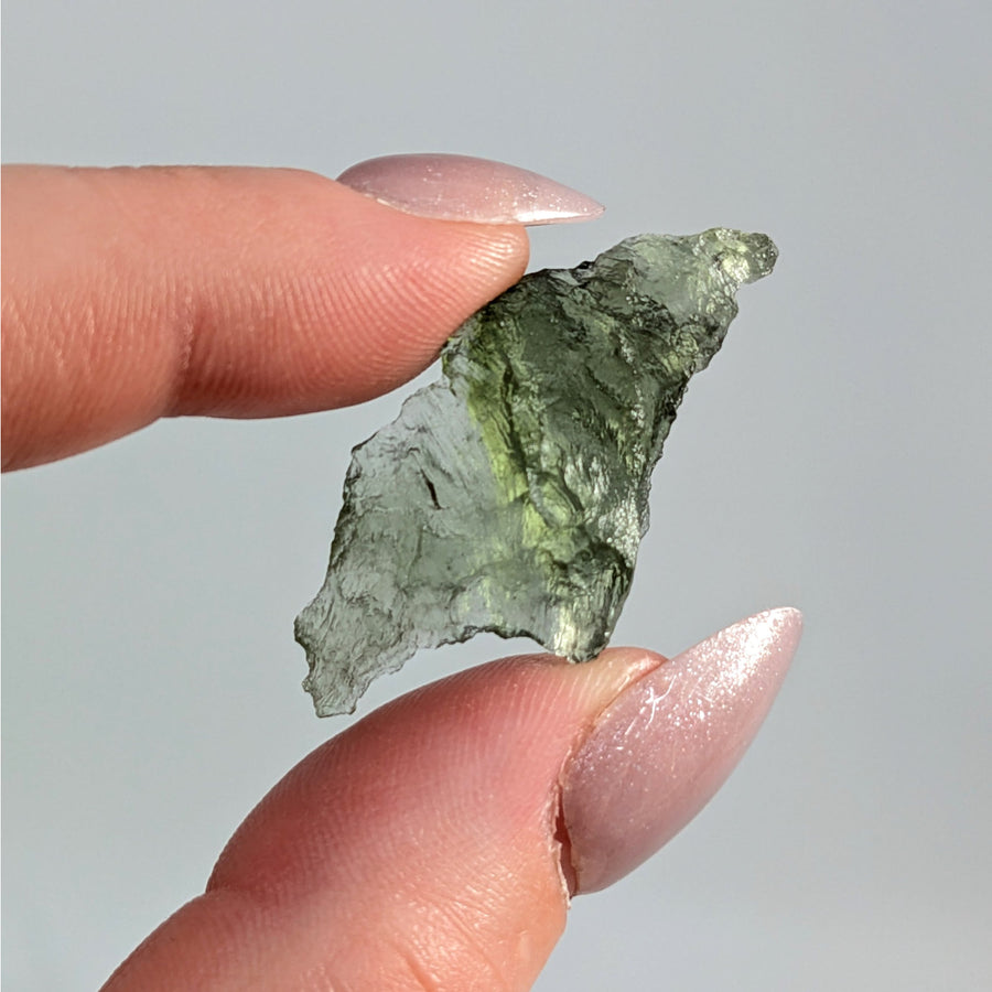 Raw Moldavite Raw Besednice from Czech Republic showcasing textured green surfaces