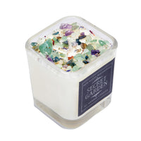 Square soy crystal candle with embedded crystals in a glass jar for Rituals and Wellness