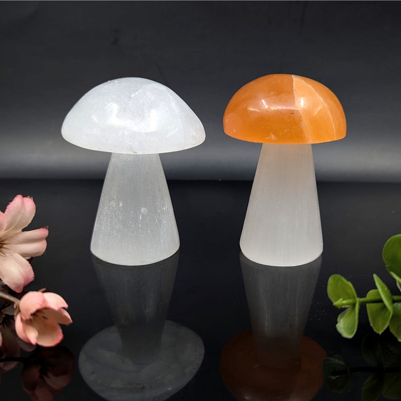 White and orange mushroom-shaped crystal figurines in Selenite 3 inch Mushroom Carving