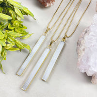 Three white chalcedony bar pendants with gold edges on 18’’ chains