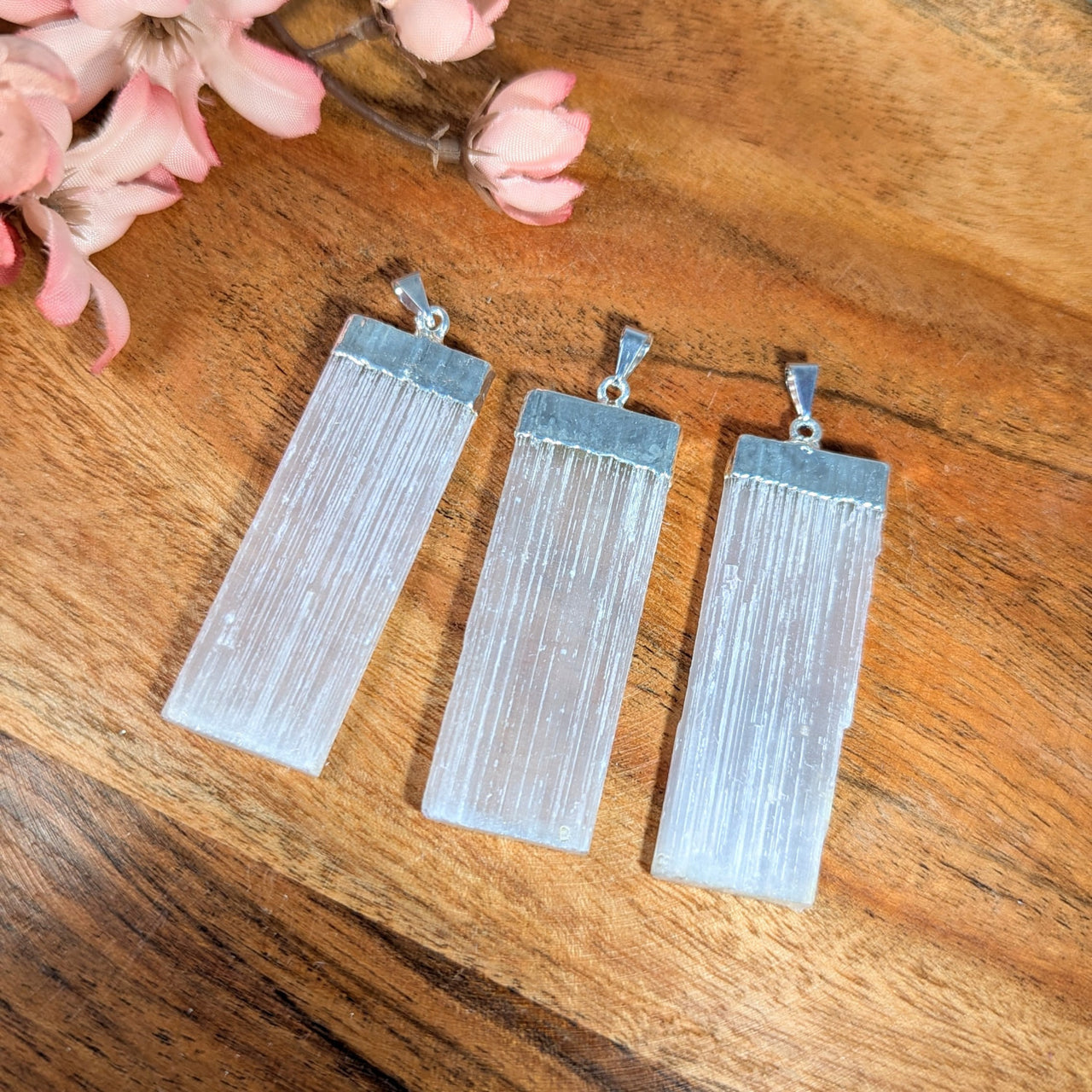 Three translucent selenite blade pendants with silver electroplate caps for jewelry and crystal enthusiasts