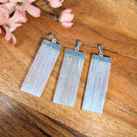Three translucent selenite blade pendants with silver electroplate caps for jewelry and crystal enthusiasts