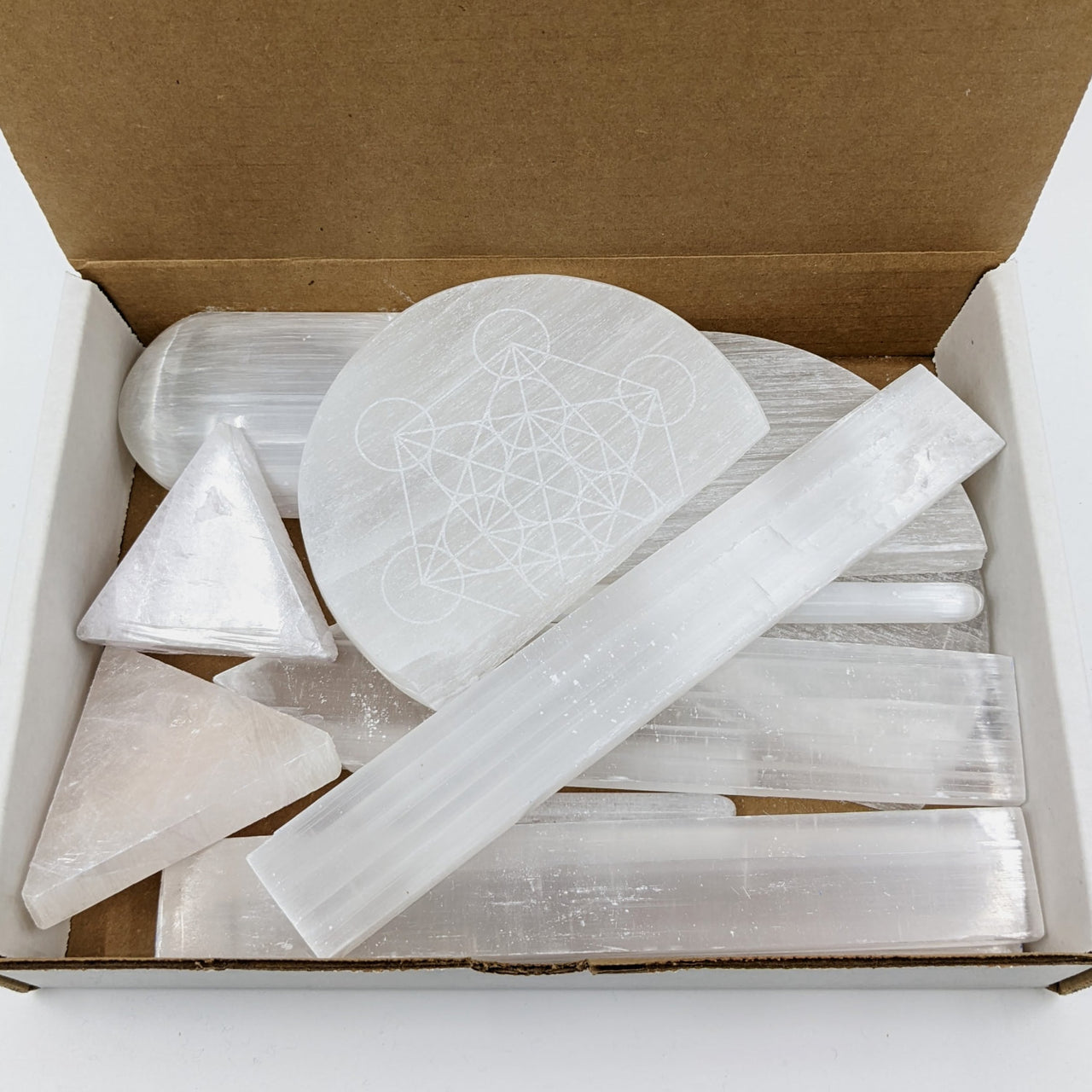 Translucent white selenite crystals in geometric shapes with sacred designs, 2lb treasure box